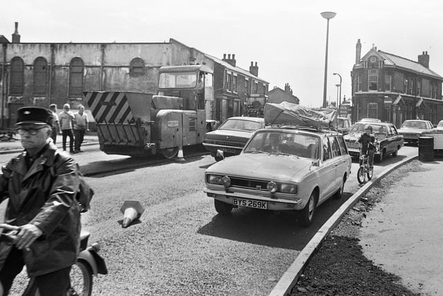 The Saddle junction, Newtown, on 7th of August 1972. Warrington Road goes off to the left and Ormskirk Road to the right with France Street and Barclays Bank on the right edge.  In the centre is the Queen's Head pub and on the left the old St. Edwards RC Church later to become the Innisfree club.
