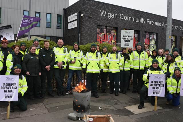 Staff from North West Ambulance Service on a picket line outside Wigan Community Fire and Ambulance Station in January