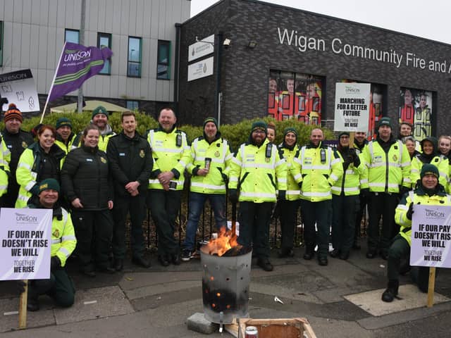 Staff from North West Ambulance Service on a picket line outside Wigan Community Fire and Ambulance Station in January