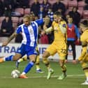 Josh Magennis tries his luck against Sutton