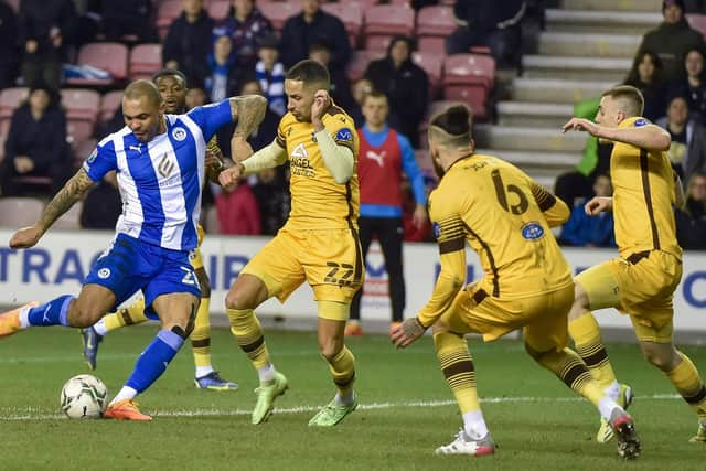 Josh Magennis tries his luck against Sutton