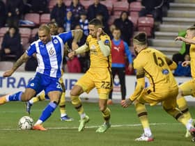 Josh Magennis tries his luck against Sutton