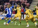 Josh Magennis tries his luck against Sutton