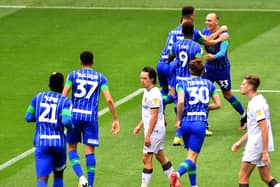 Kal Naismith celebrates scoring for Latics in the 8-0 victory over Hull in 2020