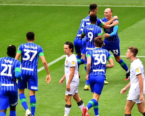 Kal Naismith celebrates scoring for Latics in the 8-0 victory over Hull in 2020