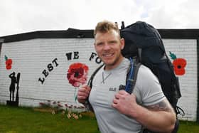 Royal Marine Commando veteran Mark Snape setting off on on his 70-mile trek, carrying up to 60lb (27.2kg) of kit, from Wigan Armed Forces Community HQ.