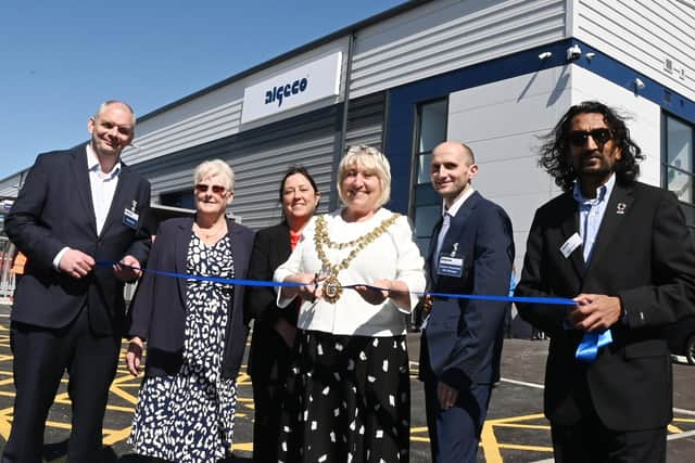 The Mayor of Wigan Coun Marie Morgan, centre, cuts the ribbon to officially open  Algeco, Europe's leading modular and offsite building solutions brand, on the former site of Morrisons supermarket, in Ince