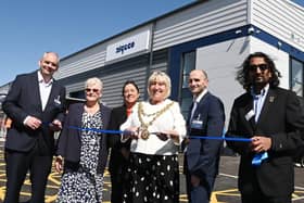 The Mayor of Wigan Coun Marie Morgan, centre, cuts the ribbon to officially open  Algeco, Europe's leading modular and offsite building solutions brand, on the former site of Morrisons supermarket, in Ince