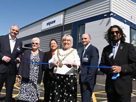 The Mayor of Wigan Coun Marie Morgan, centre, cuts the ribbon to officially open  Algeco, Europe's leading modular and offsite building solutions brand, on the former site of Morrisons supermarket, in Ince