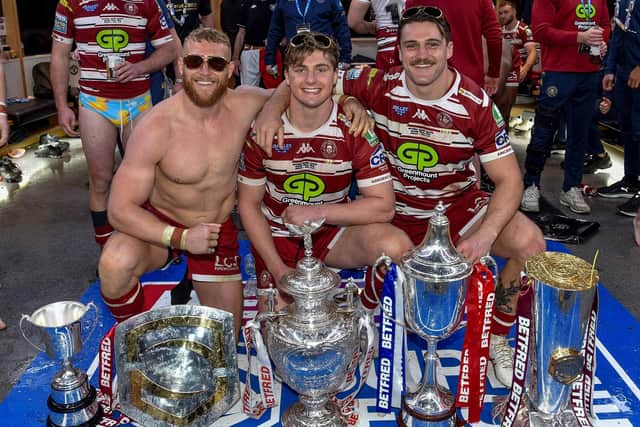 Luke Thompson, Ethan Havard and Liam Byrne celebrate with trophies