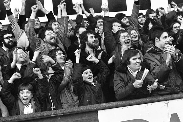 Fans enjoying Wigan's match against St. Helens amateur side Pilkington Recs in the first round of the Challenge Cup at Knowsley Road on Sunday 13th of February 1977 which Wigan narrowly won 10-4.