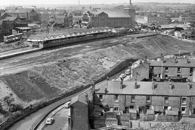 A view taken from the newly built Woodcock House flats towards the closed Central Station with the Ritz cinema behind. On the right is Crompton Street and in the foreground is Derby Terrace with rows of houses in Bold Street and Low Street in July 1966.