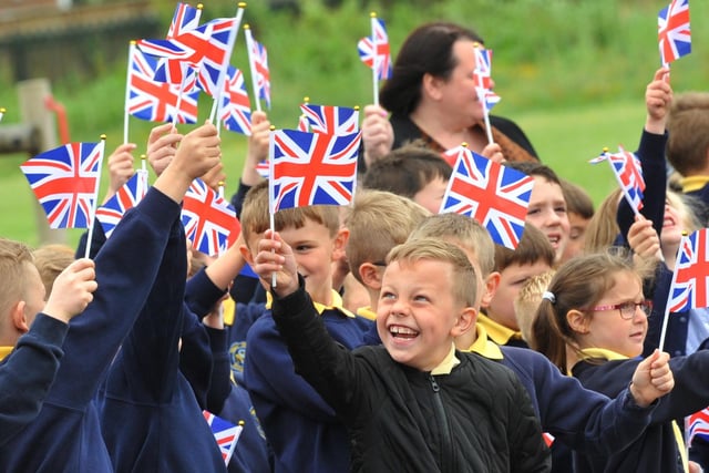Year Six pupils at Nicole Mere Primary School, Ashton-in-Makerfield, take part in the Trooping of the Colours parade, in front of staff and pupils waving flags, to end a week of celebrations for the Queen's platinum jubilee.