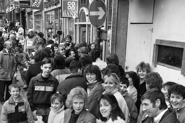 On the breadline....."Bread" fans outside the new Co-Operative bank in Market Street wait to get Jonathon Morris's autograph.