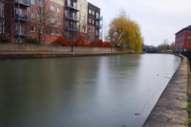 Emergency services are warning members of the public about the dangers of frozen water and not to stand on the ice.  Sections of the Leeds Liverpool Canal are frozen over, pictured near Wigan Investment Centre.