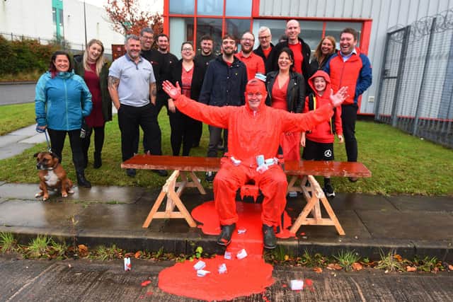 Mike Hyde, managing director at Truline Construction and Interior Services, Wigan, gets covered in red gunge for last years campaign