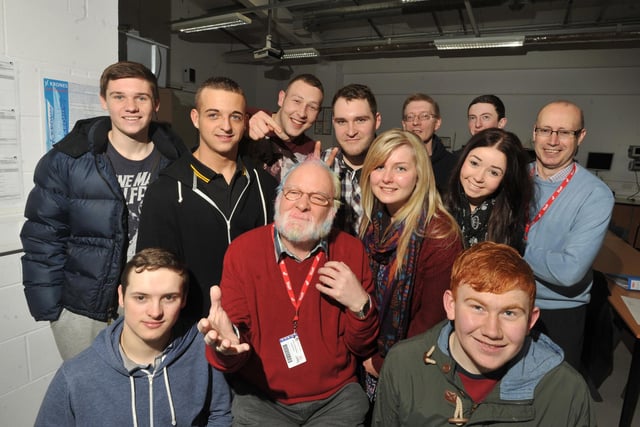Electrical engineering tutor Arthur Rutherford dyed his hair and beard bright colours for Comic Relief, pictured with students at Wigan and Leigh College