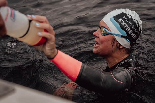 Andrea Mason swam 65km, cycled 800km and ran 44km up three mountains whilst gaining 3400m of height. Credit: Olly Bowman Photography