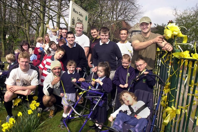 Wigan Rugby Club skipper Andy Farrell and team-mates Brett Dallas, Brian Carney, Terry O'Connor, Terry Newton and Adrian Lam tying yellow ribbons at Mere Oaks School as part of the campaign against its closure on Monday 31st of March 2003.