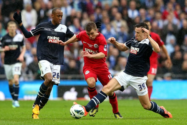 Callum McManaman of Wigan Athletic is closed down by Nadjim Abdou and Sean St Ledger of Millwall