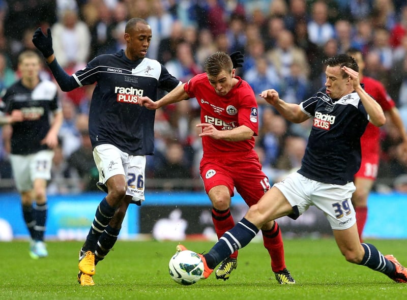 Callum McManaman of Wigan Athletic is closed down by Nadjim Abdou and Sean St Ledger of Millwall
