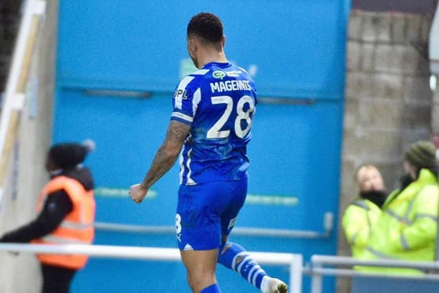 Skipper Josh Magennis celebrates levelling the scores just after the hour mark
