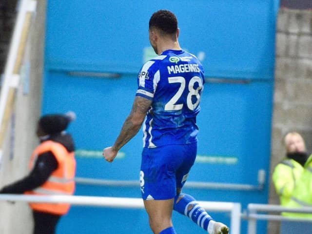 Skipper Josh Magennis celebrates levelling the scores just after the hour mark