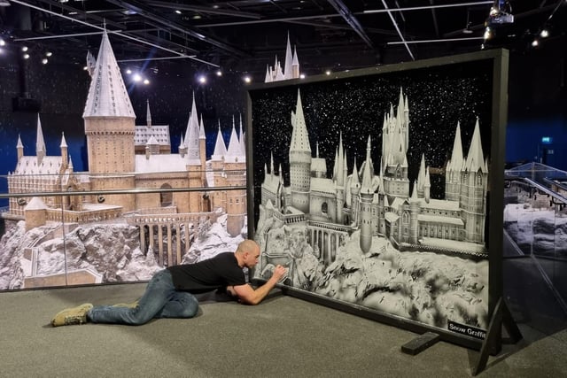 Scott Wilcock working on a design at Warner Bros Harry Potter World, London.