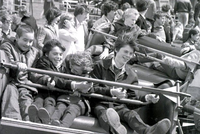 All the fun of the fair in Wigan during the May bank holiday 1982.