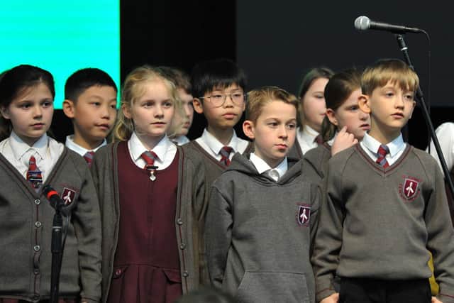 Pupils from 11 primary schools in the Wigan borough practise for the Wigan Council's Music Service choir event, held at The Edge, Wigan.