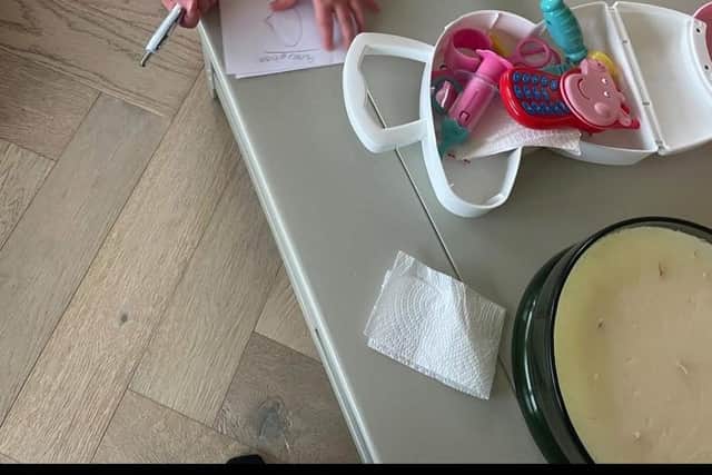 I encourage imaginative play with prompts. Here little one is writing a prescription for baby.