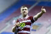 Wigan's Harry Smith thanks the fans for their support after victory over Huddersfield