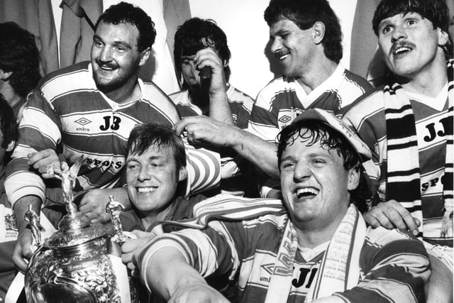 Wigan players celebrating in the Wembley dressing room after beating Hull in the 1985 final are physio, Keith Mills and Brian Dunn, Back, left to right, Brian Case, Nick du Toit and Ian Potter.