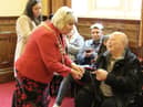 Dave Grundy receives the Heart of the Community award from Mayor of Wigan Coun Marie Morgan