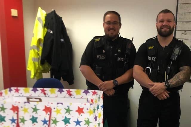 Officers with the gifts sent by Harvey