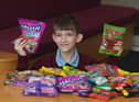 Callum Holden, 10, with sweets for people from Ukraine
