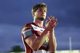 Ethan Havard applauds the Wigan Warriors fans
