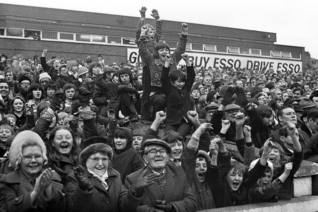 Happy Wigan fans after the Challenge Cup 2nd round match against St. Helens at Central Park on Sunday 18th of February 1973 which Wigan won 15-2.
