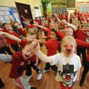 Pupils at RL Hughes Primary School, Ashton, dressed in red for their Red Nose Day 'Danceathon' in aid of Comic Relief