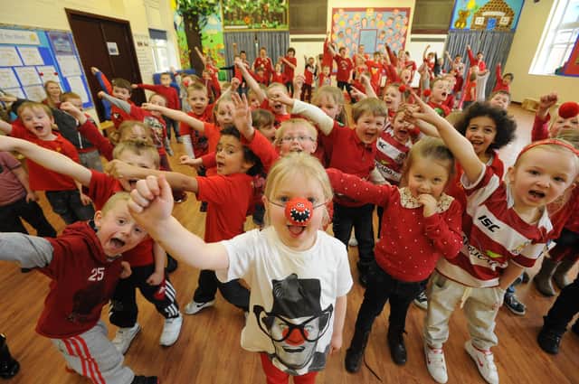 Pupils at RL Hughes Primary School, Ashton, dressed in red for their Red Nose Day 'Danceathon' in aid of Comic Relief