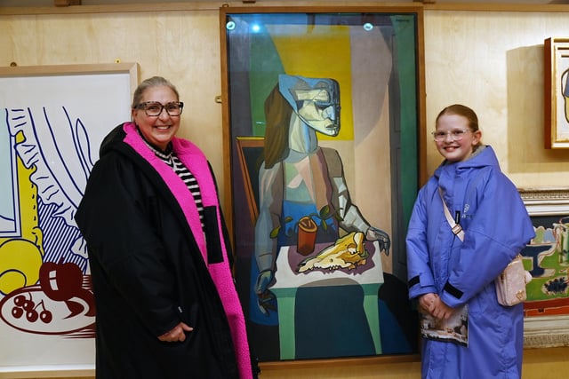 Sam Scales and Molly enjoy the exhibition as they admire Robert Colquhoun's Woman with Still Life (1958)