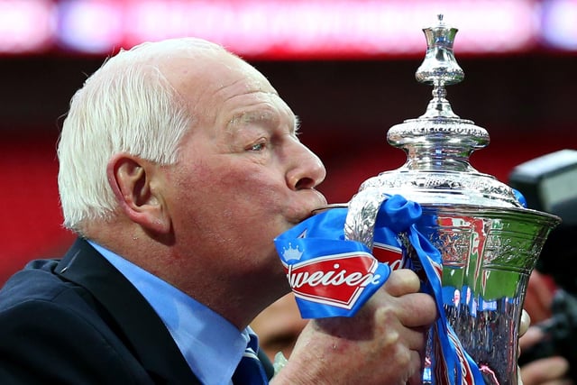 Wigan chairman Dave Whelan kisses the trophy following his team's 1-0 victory during the FA Cup with Budweiser Final between Manchester City and Wigan Athletic at Wembley Stadium on May 11, 2013 in London, England.  (Photo by Alex Livesey/Getty Images)