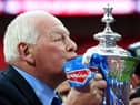 Wigan chairman Dave Whelan kisses the trophy following his team's 1-0 victory during the FA Cup with Budweiser Final between Manchester City and Wigan Athletic at Wembley Stadium on May 11, 2013 in London, England.  (Photo by Alex Livesey/Getty Images)