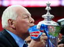 Wigan chairman Dave Whelan kisses the trophy following his team's 1-0 victory during the FA Cup with Budweiser Final between Manchester City and Wigan Athletic at Wembley Stadium on May 11, 2013 in London, England.  (Photo by Alex Livesey/Getty Images)