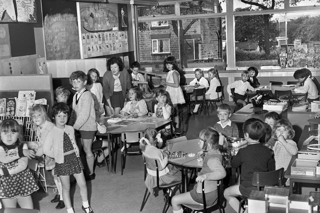 Mrs.Teresa Harris with pupils working on projects in one of the open plan classes at St. Bernadettes RC Primary School, Shevington, in July 1972.