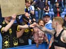 James McClean gives his shirt to a lucky fan at Reading after Latics' relegation was confirmed