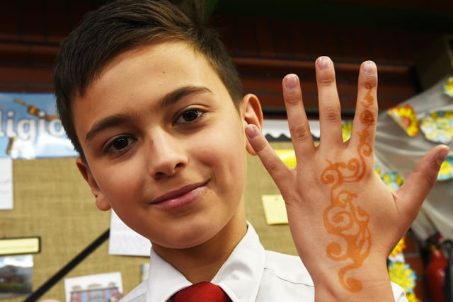 Pupils created art on their hand with traditional henna