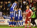 The Latics players celebrate another goal against Accrington