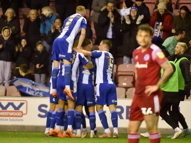 The Latics players celebrate another goal against Accrington