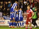 The Latics players celebrate another goal against Accrington